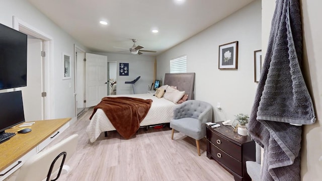 bedroom with ceiling fan and light hardwood / wood-style floors