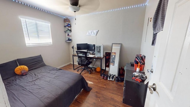 bedroom with dark hardwood / wood-style floors