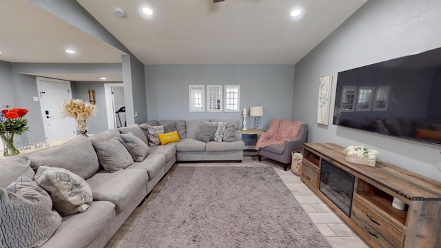 living room featuring vaulted ceiling