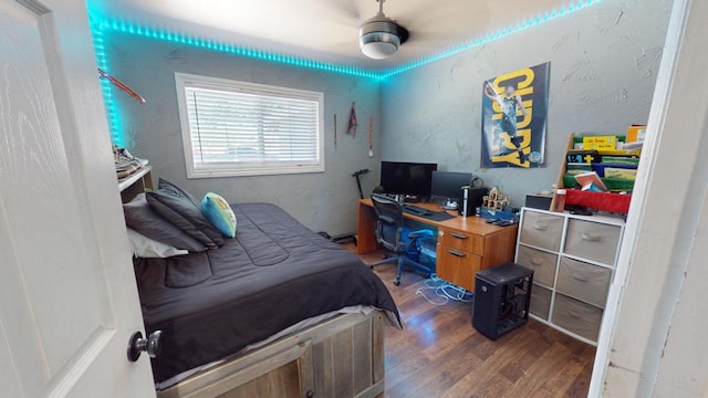 bedroom featuring dark hardwood / wood-style flooring