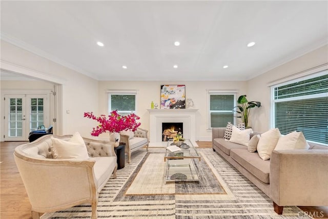 living room with ornamental molding, french doors, recessed lighting, and wood finished floors