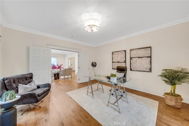 office area with ornamental molding, baseboards, a chandelier, and wood finished floors