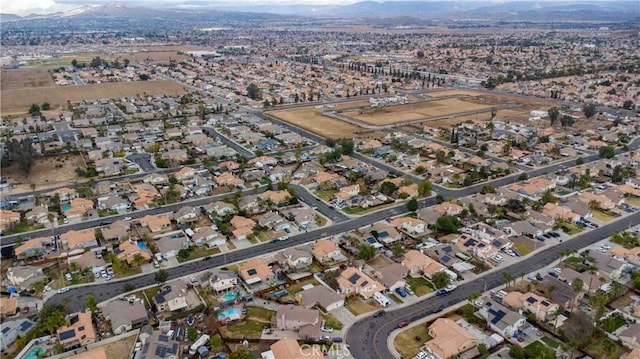 drone / aerial view featuring a mountain view and a residential view