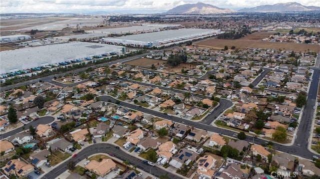 birds eye view of property featuring a mountain view