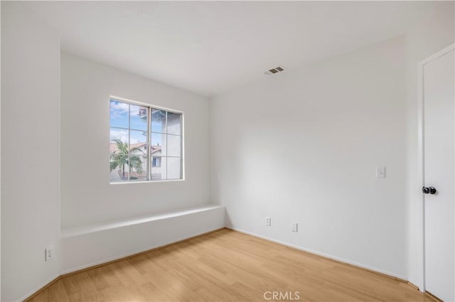 unfurnished room featuring wood-type flooring