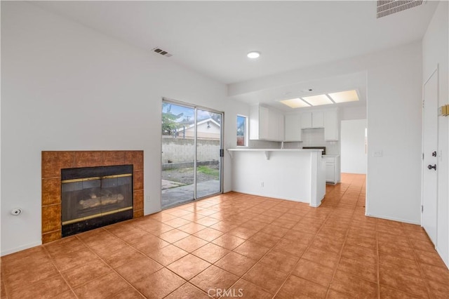 unfurnished living room with a fireplace