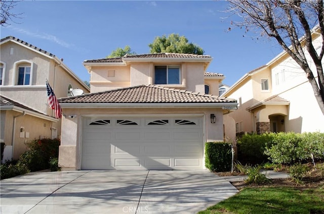 mediterranean / spanish home with a garage