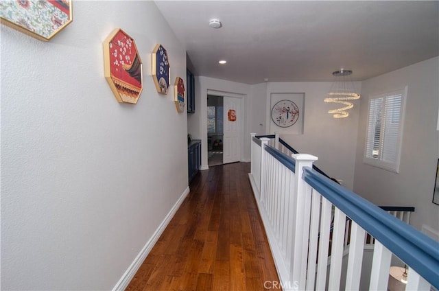 corridor with dark hardwood / wood-style flooring