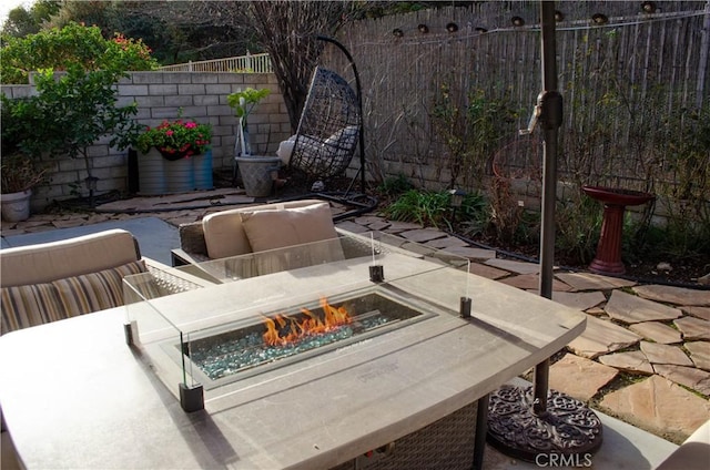 view of patio with an outdoor fire pit