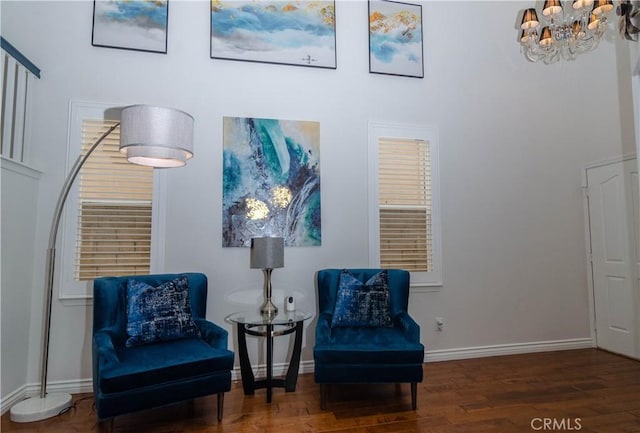 sitting room with dark hardwood / wood-style flooring