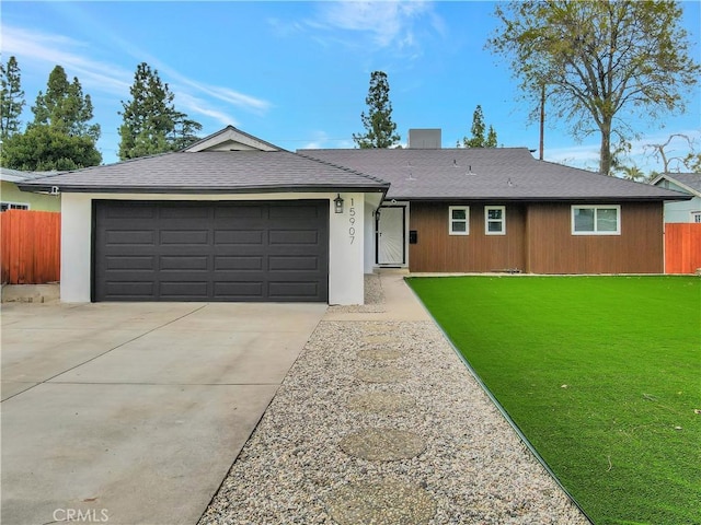 ranch-style home with a front yard and a garage