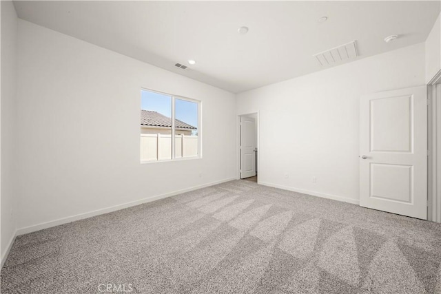 empty room featuring carpet floors