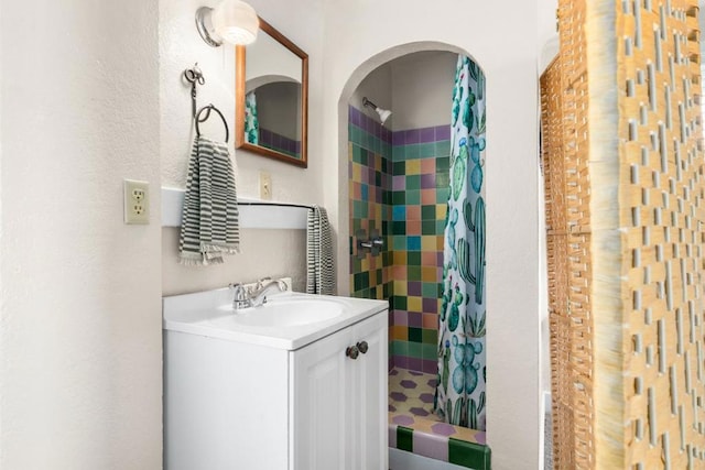 bathroom with vanity and shower / bath combo with shower curtain