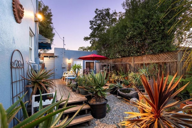 yard at dusk with a deck