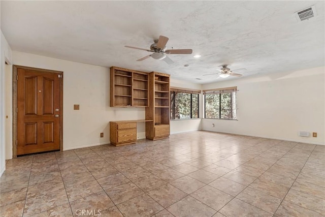 unfurnished living room featuring a ceiling fan, baseboards, light tile patterned floors, and visible vents