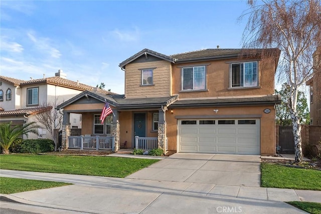 view of front of house with stucco siding, covered porch, an attached garage, a front yard, and driveway