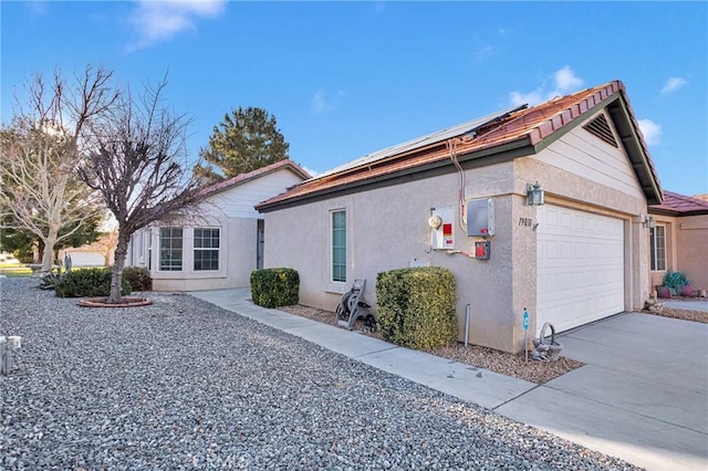 view of side of home with a garage