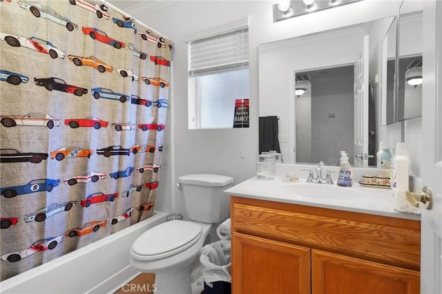 full bathroom featuring vanity, ornamental molding, toilet, and shower / bathtub combination with curtain