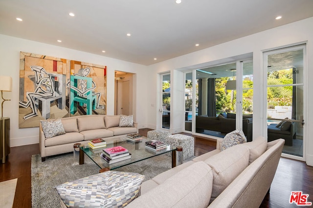 living room with dark hardwood / wood-style flooring