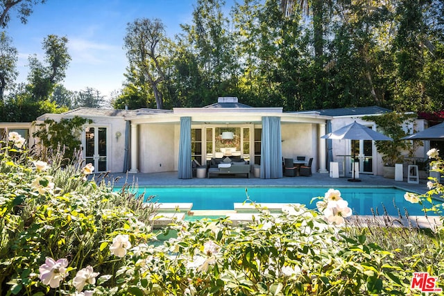 rear view of property featuring a patio area