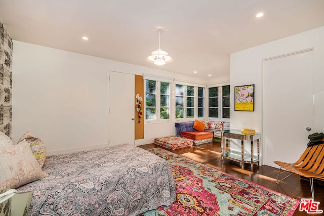 bedroom with hardwood / wood-style floors