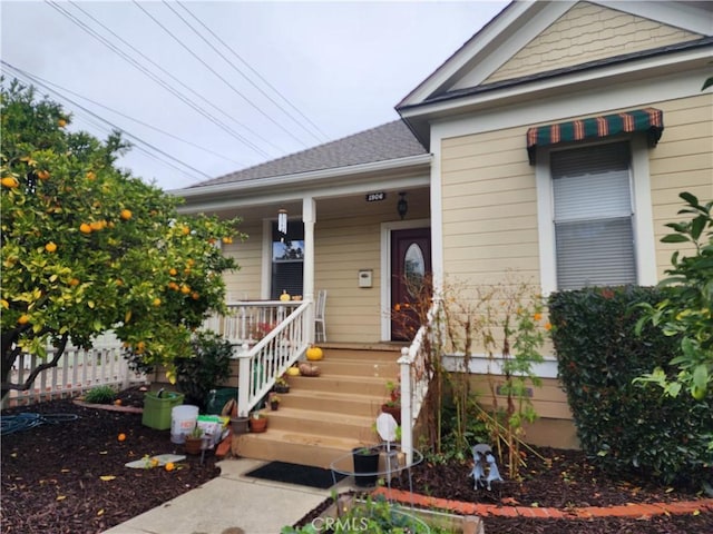 doorway to property with covered porch