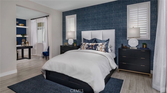 bedroom with light hardwood / wood-style flooring