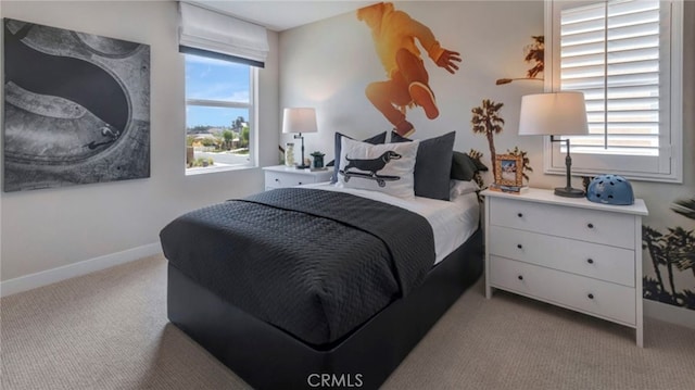 bedroom featuring light carpet