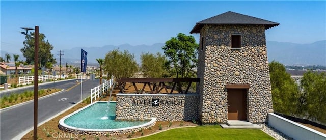 view of pool featuring a mountain view and pool water feature