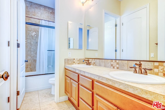 full bathroom with backsplash, shower / bath combination with glass door, tile patterned flooring, vanity, and toilet