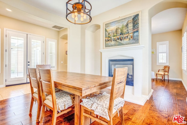 dining room with an inviting chandelier and light hardwood / wood-style floors