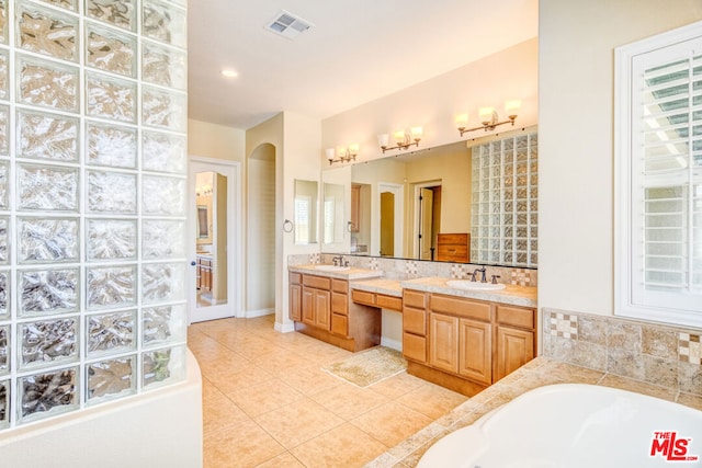 bathroom featuring tile patterned flooring and vanity