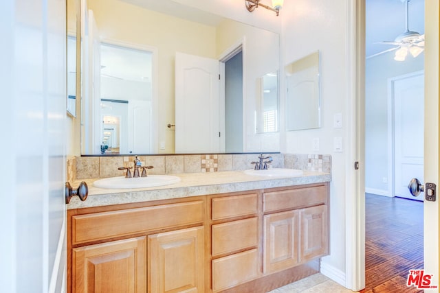 bathroom featuring vanity, wood-type flooring, and ceiling fan