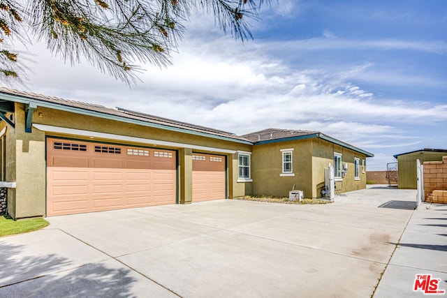 view of side of property featuring a garage