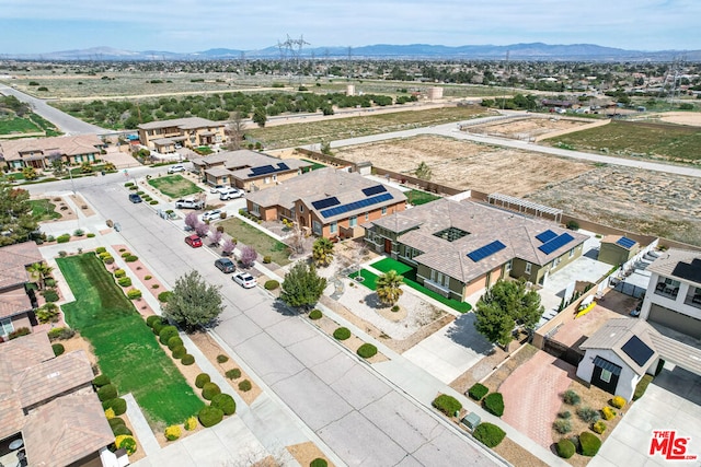 birds eye view of property featuring a mountain view