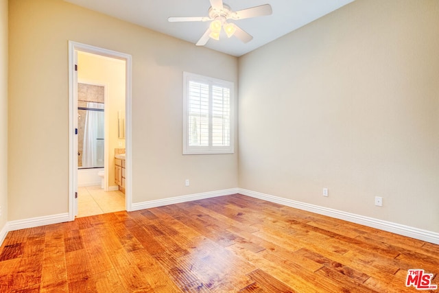 unfurnished room with ceiling fan and light hardwood / wood-style floors