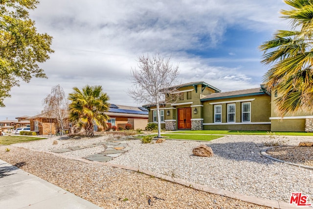 prairie-style home with a front lawn