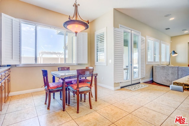 dining area featuring light tile patterned floors