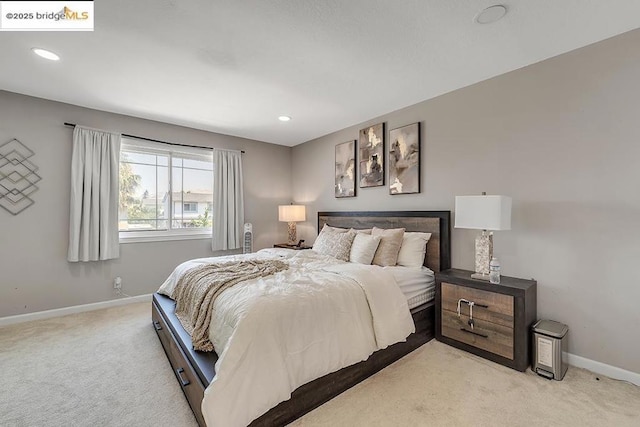 bedroom with light carpet