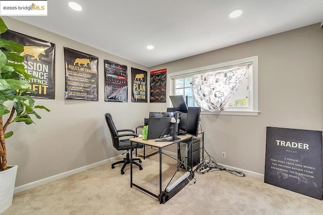 office area featuring light carpet