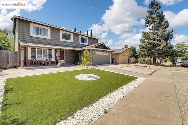 front of property featuring a garage, a porch, and a front lawn