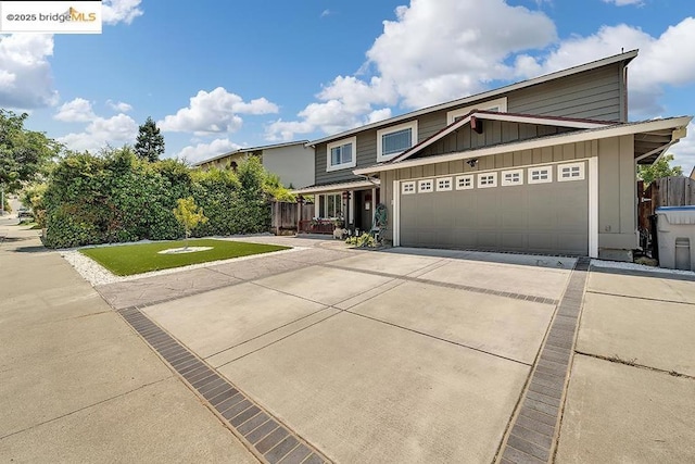 view of front of house with a garage and a front yard