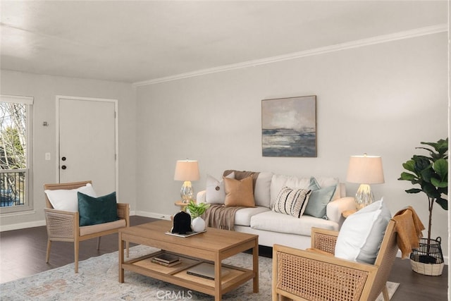 living room with dark wood-type flooring and ornamental molding