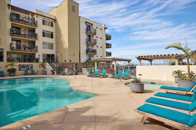 view of swimming pool with a pergola and a patio area