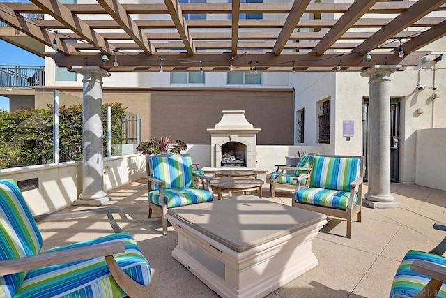 view of patio featuring a pergola and an outdoor living space with a fireplace