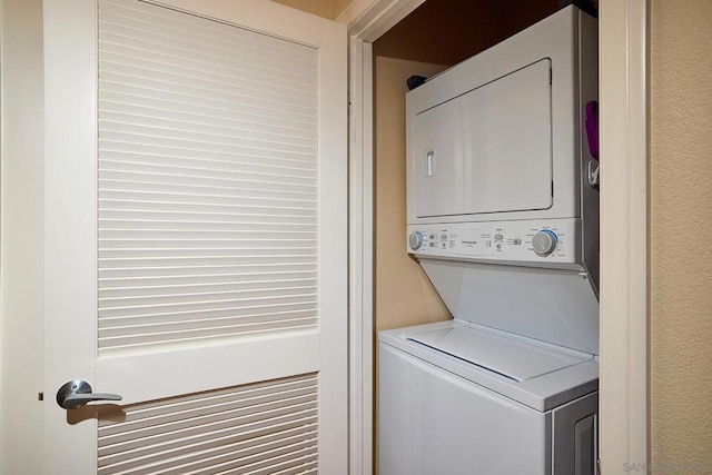 laundry area with stacked washer / dryer