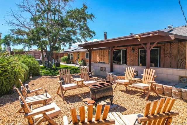 exterior space featuring an outdoor fire pit