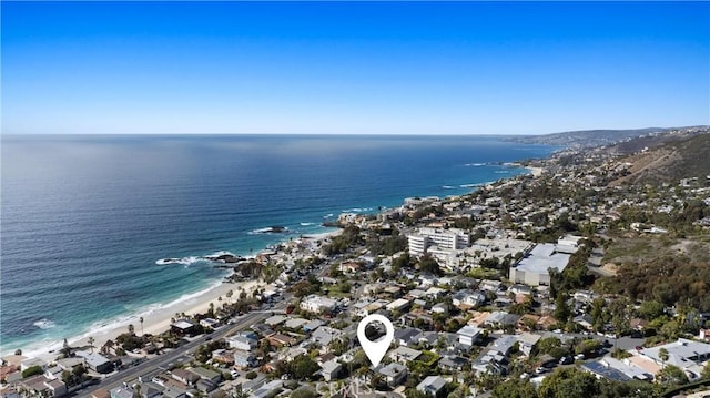 bird's eye view with a water view and a beach view