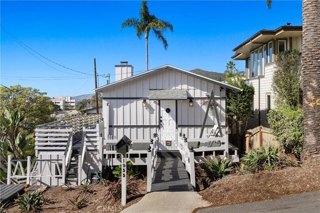 31955 10th Ave, Laguna Beach, CA 92651 - view of front of home with a chimney and board and batten siding