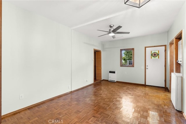 empty room featuring heating unit, washer / dryer, parquet flooring, and ceiling fan